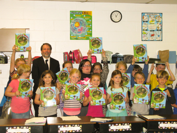 Bryan Watts with students from Broadwater Academy after they received their own copies of Hope is here.”
